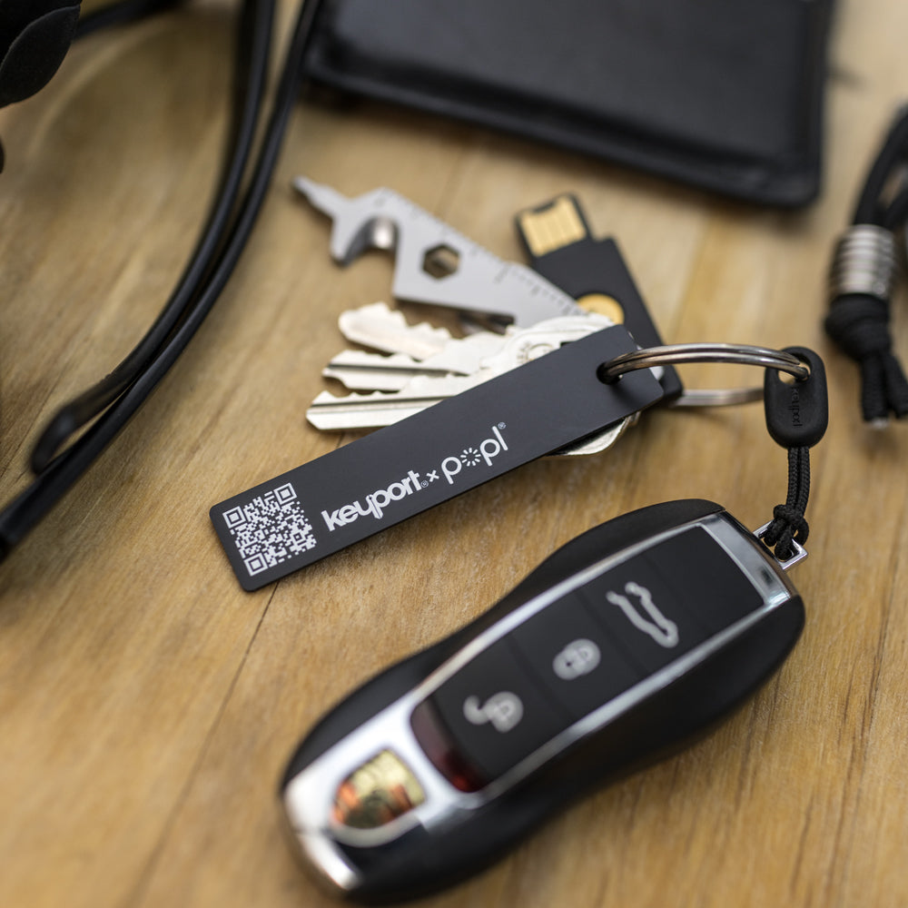 Popl x Keyport Digital ME Key electronic business card on a key chain with Porsche key fob