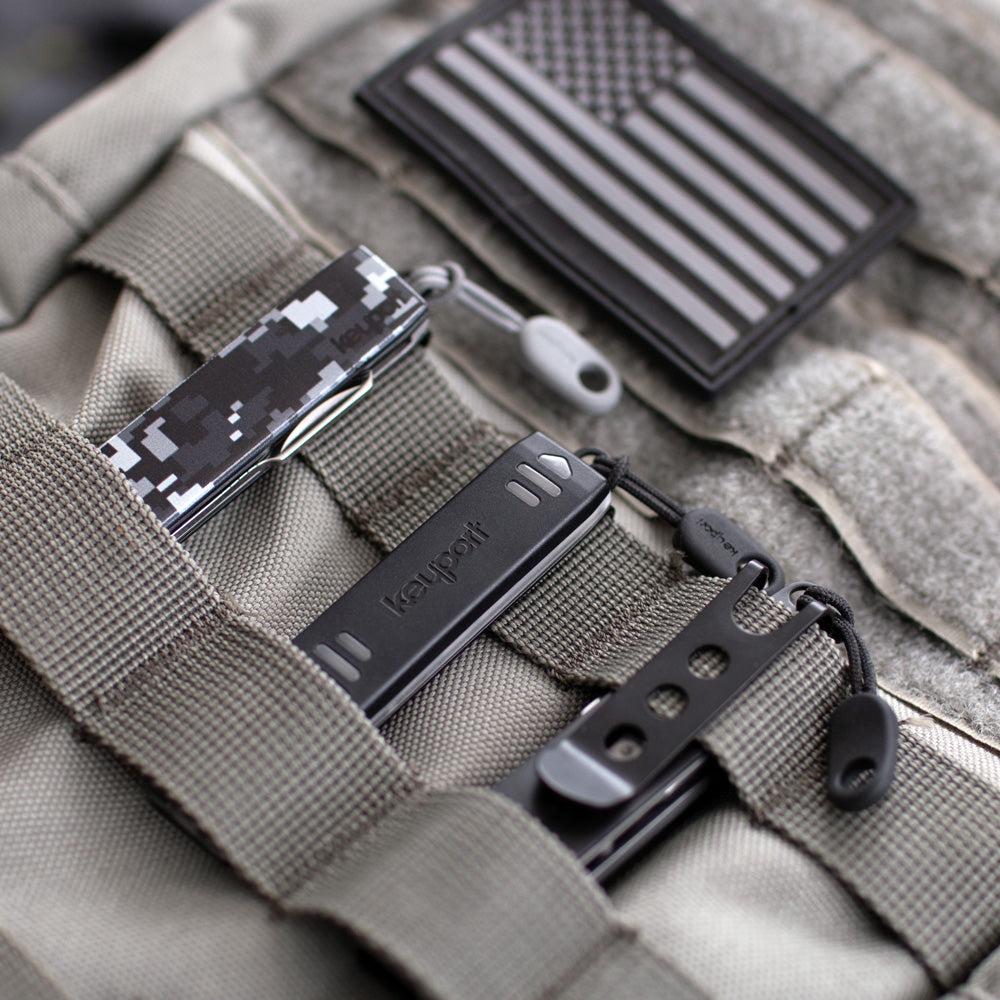 Anywhere Tools - Pocket Flare, NEBA, and MOCA II 11-in-1 Modules - clipped to a molle backpack