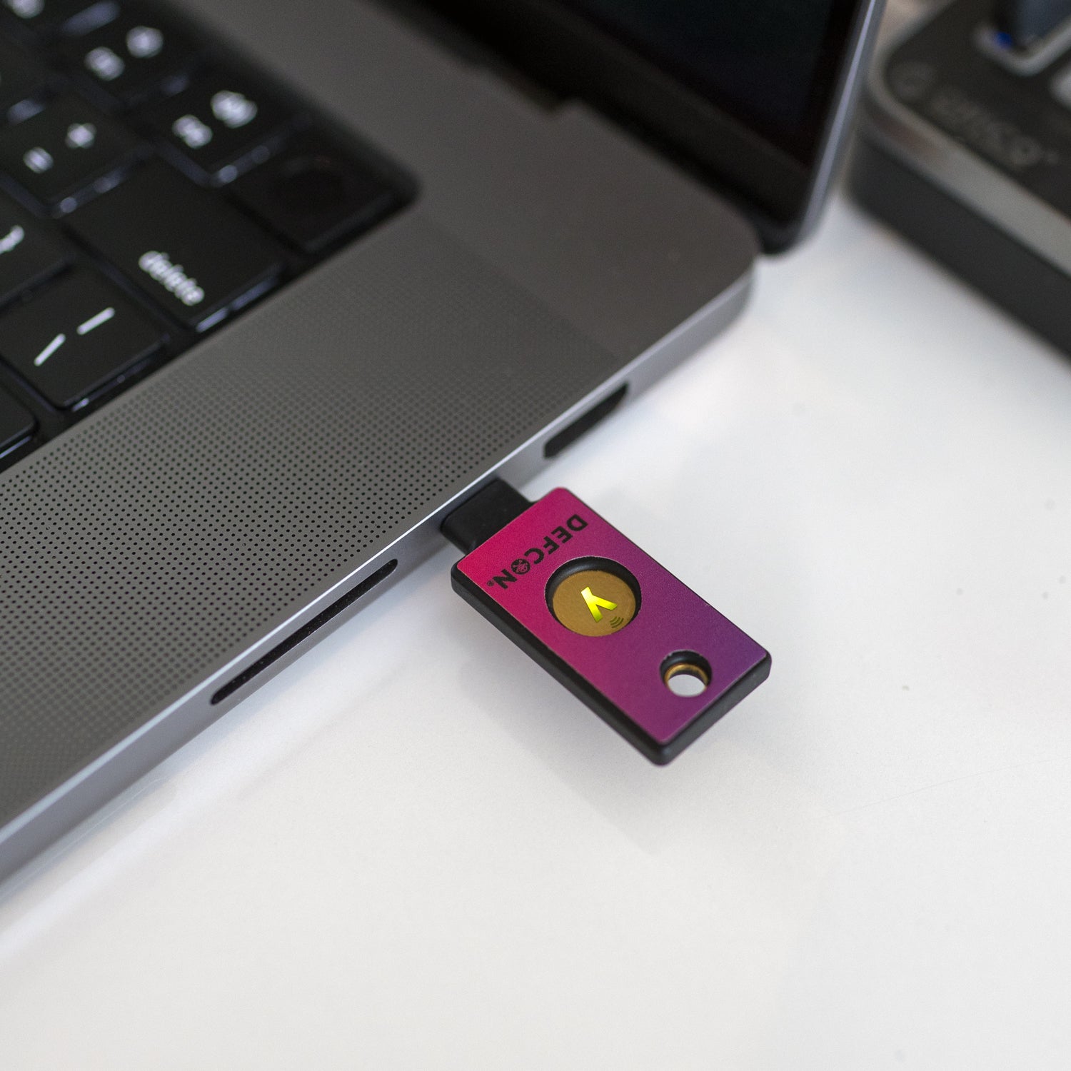 DEF CON 32 Yubistyle covered YubiKey in a MacBook USB-C port