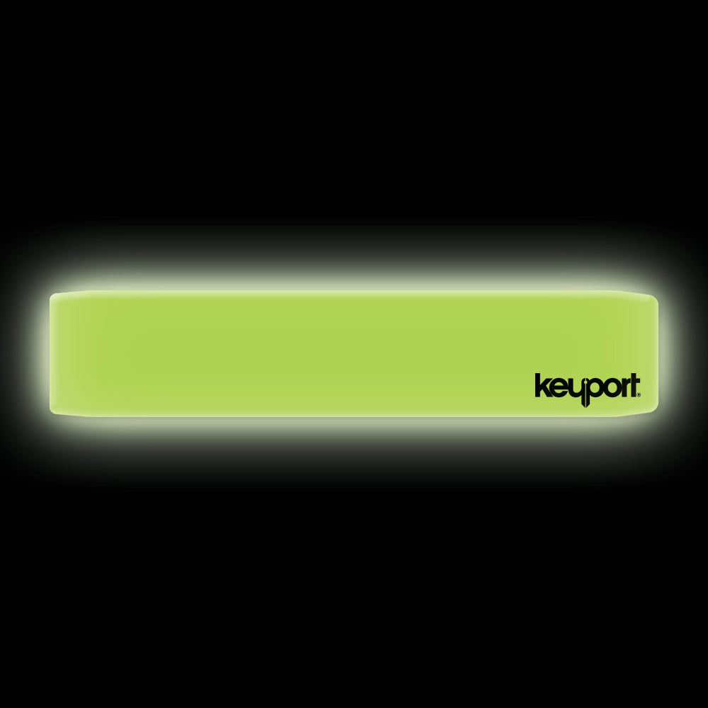 Keyport faceplate that glows in the dark on a black background