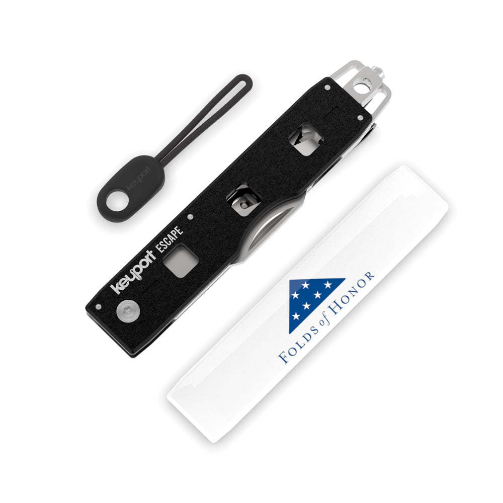 The Folds of Honor Escape Tool Kit features a seatbelt cutter, window glass breaker, FoH Faceplate, pocket clip, & ParaPull