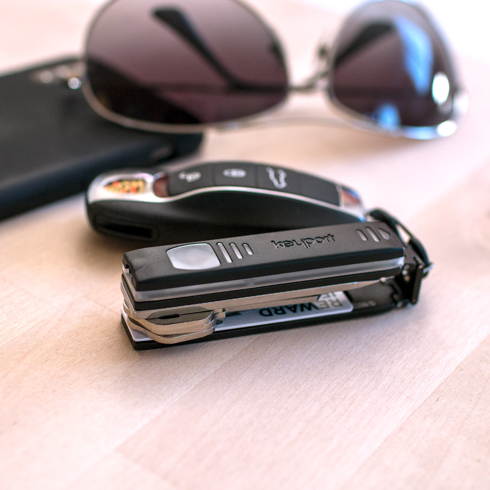 Keyport Pivot key organizer keychain with Pocket Flare, KeyportID lost & found, and keys with Porsche key fob attached