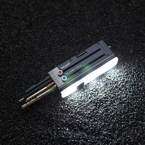 4-port Titanium Keyport Slide 4.0 LE1 with lamp mode engaged